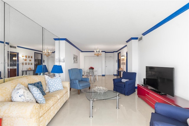 living room with a notable chandelier, crown molding, and tile patterned floors