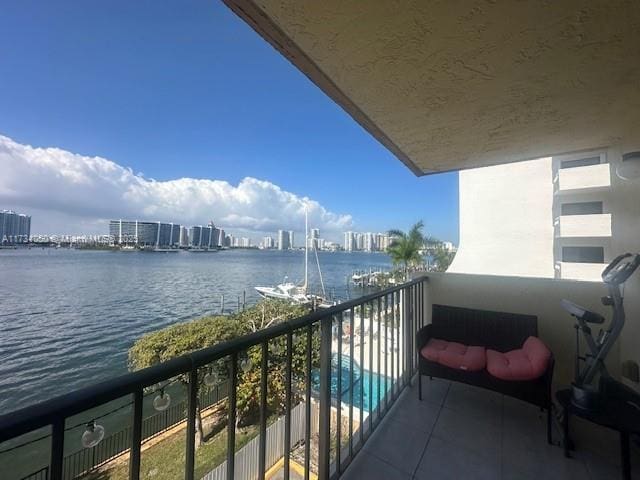 balcony featuring a water view