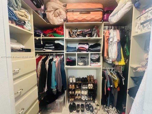 spacious closet with tile patterned flooring