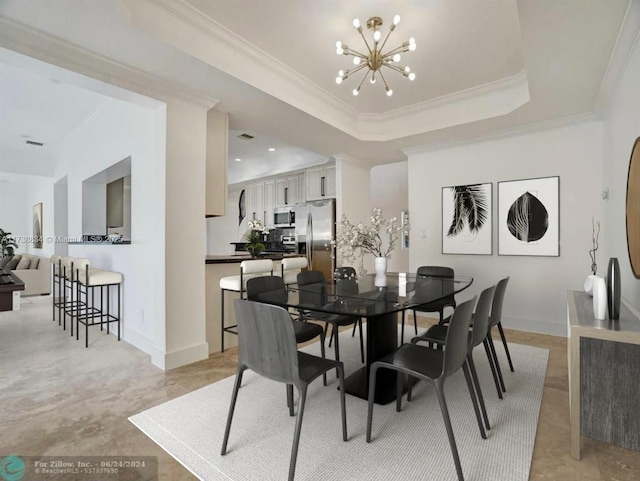 dining space with an inviting chandelier, a tray ceiling, and crown molding