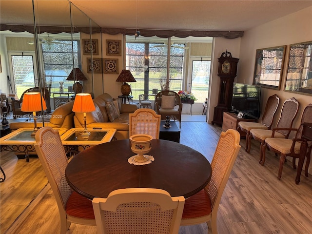 dining space with hardwood / wood-style flooring