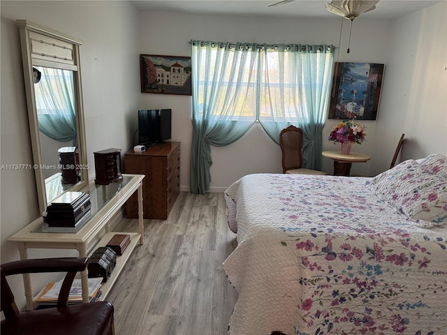 bedroom with light hardwood / wood-style floors