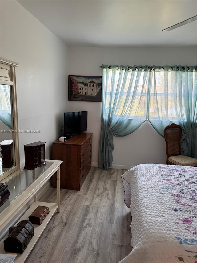 bedroom featuring light wood-type flooring