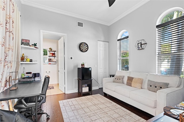 living room featuring crown molding and dark hardwood / wood-style floors