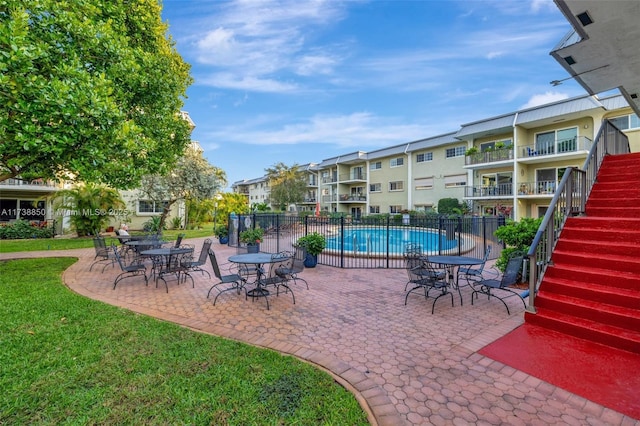 view of patio featuring a community pool