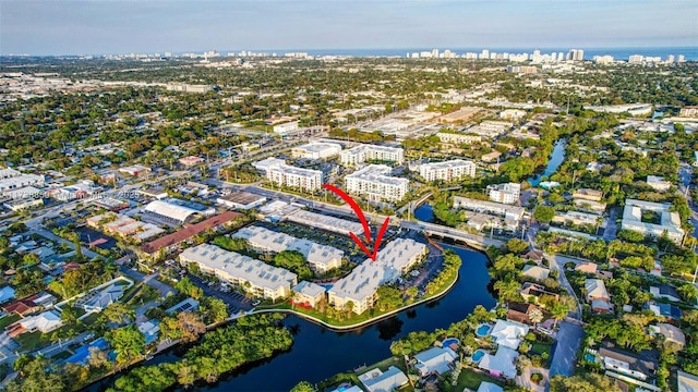 birds eye view of property featuring a water view