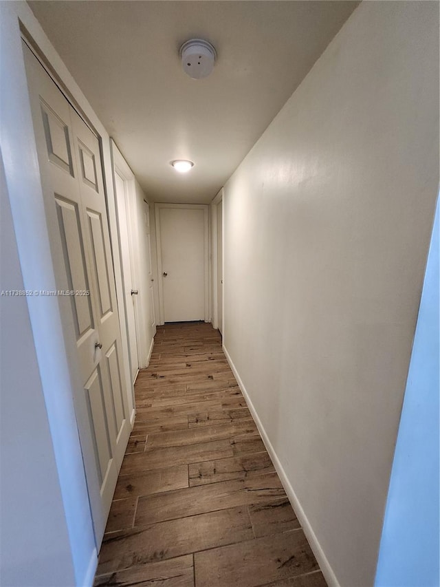 hallway with light wood-type flooring