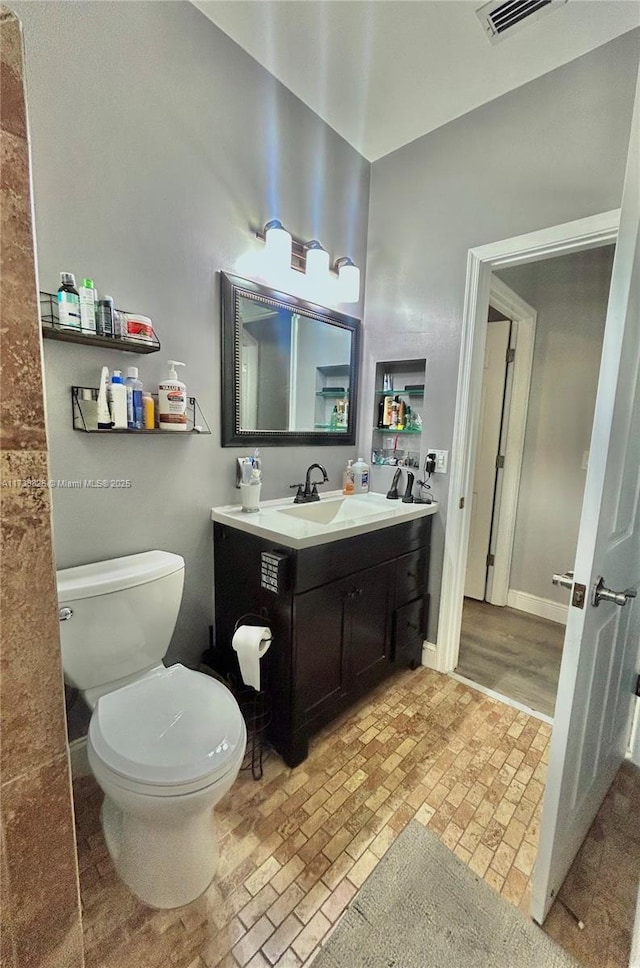 bathroom with vanity and toilet