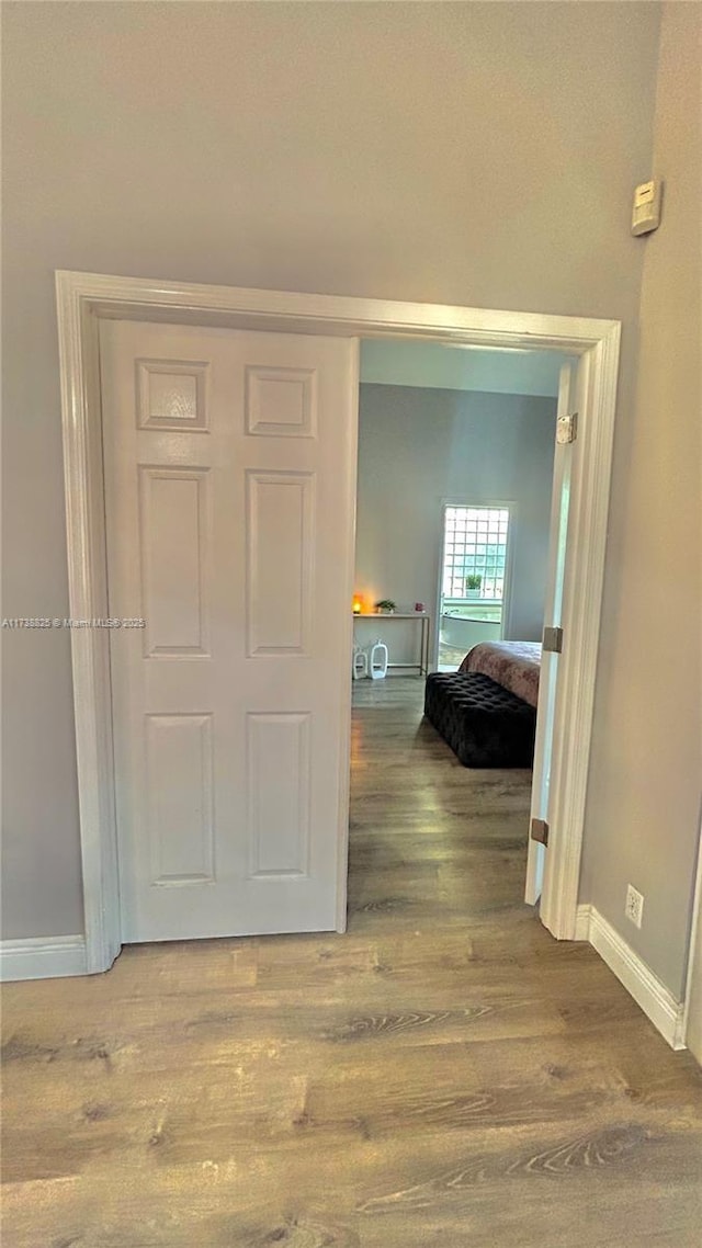 hallway featuring hardwood / wood-style flooring