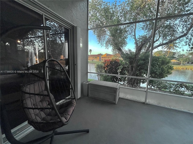 sunroom with a water view