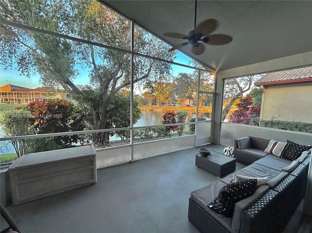 sunroom featuring a water view, ceiling fan, and lofted ceiling