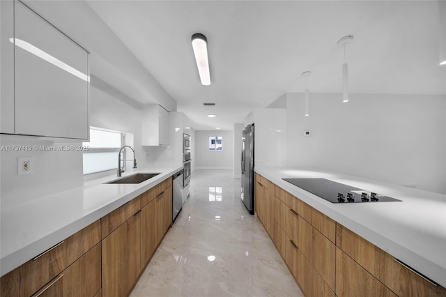 kitchen featuring white cabinetry, sink, and stainless steel appliances