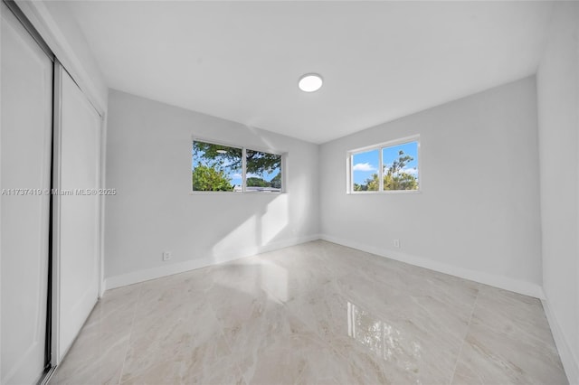 unfurnished bedroom with a closet