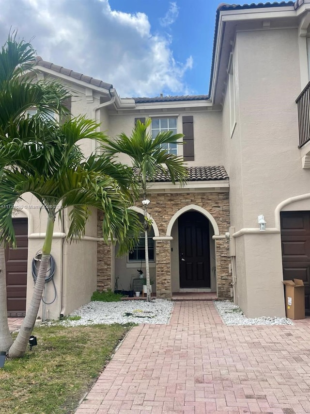 view of exterior entry with a garage