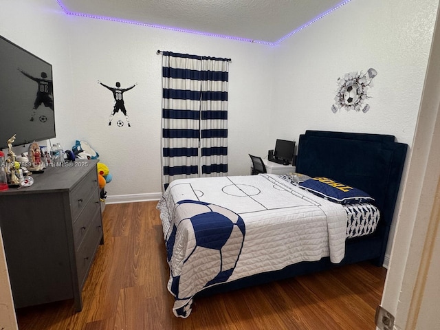 bedroom featuring dark hardwood / wood-style flooring