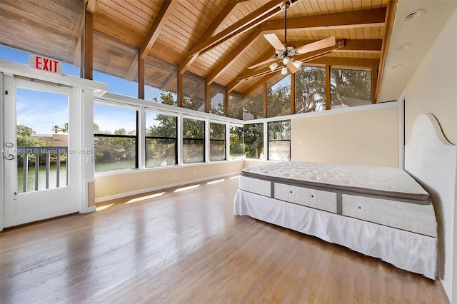 unfurnished bedroom with a water view, beamed ceiling, wood-type flooring, and wooden ceiling