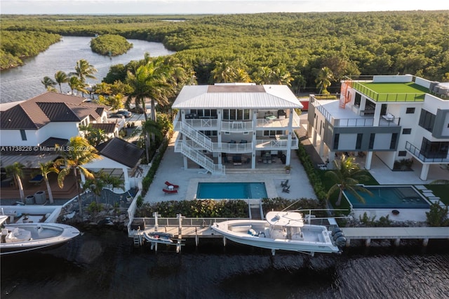 birds eye view of property with a water view