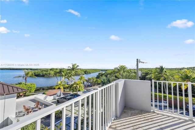 balcony featuring a water view