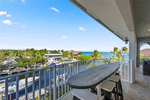 balcony featuring a water view