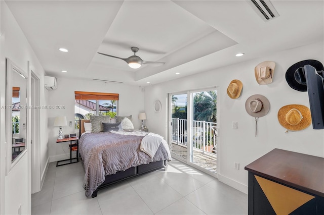 bedroom featuring ceiling fan, a wall mounted AC, light tile patterned flooring, access to outside, and a raised ceiling