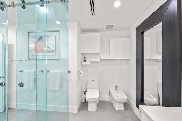 bathroom with a bidet, tile patterned floors, toilet, and a shower with door