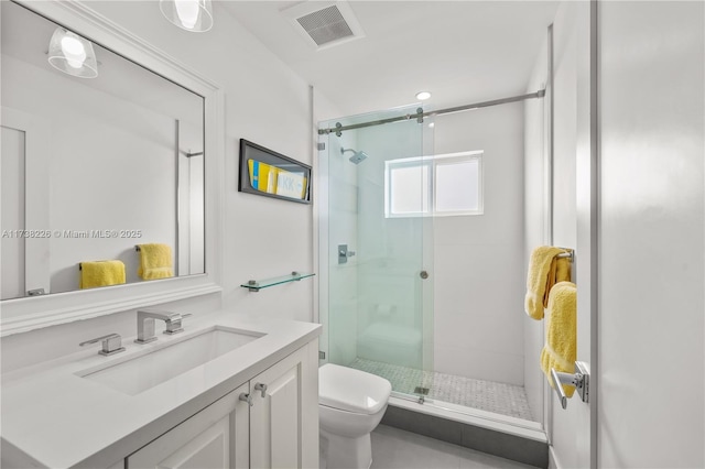 bathroom with an enclosed shower, vanity, and toilet