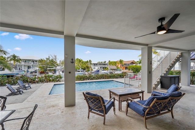 view of pool featuring a patio and ceiling fan