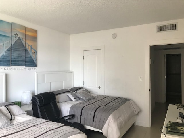 bedroom featuring a textured ceiling