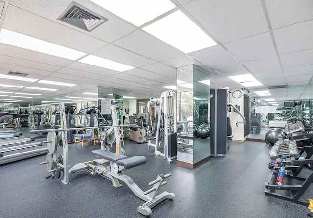 exercise room featuring a drop ceiling