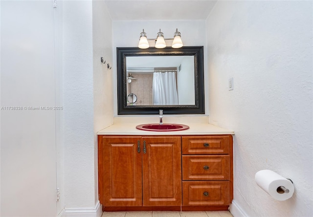 bathroom featuring vanity and a shower with shower curtain