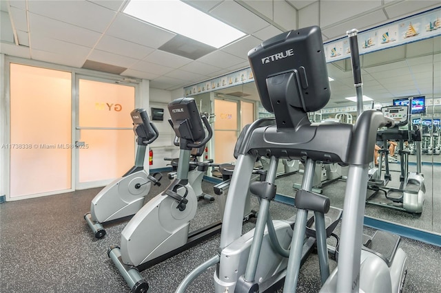 gym featuring a paneled ceiling