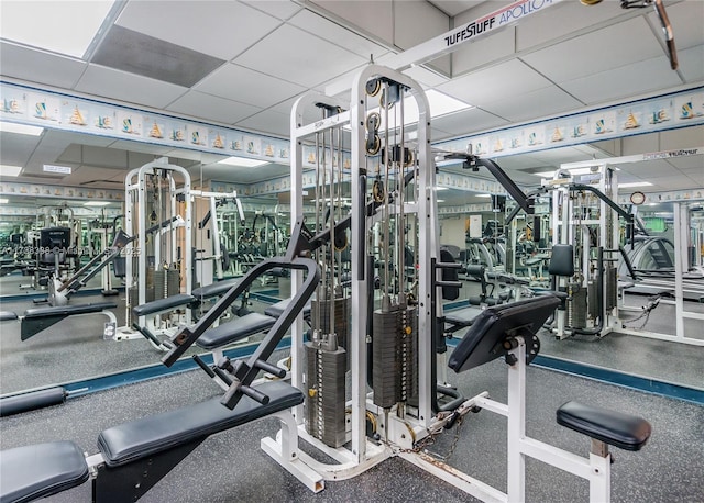 workout area with a drop ceiling