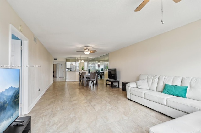 living room with ceiling fan