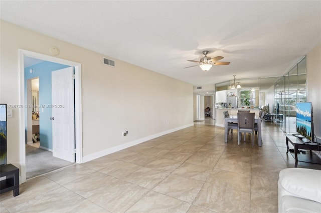 living room with a textured ceiling and ceiling fan