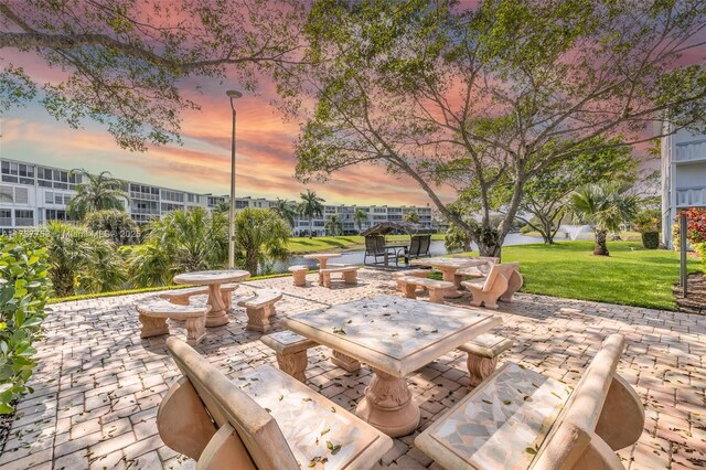 patio terrace at dusk with a lawn