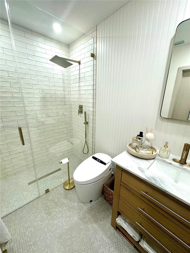 bathroom with vanity, a shower with shower door, and toilet