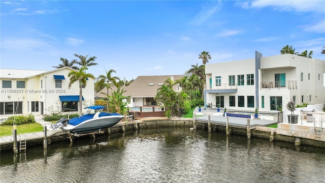 exterior space featuring a water view and a balcony