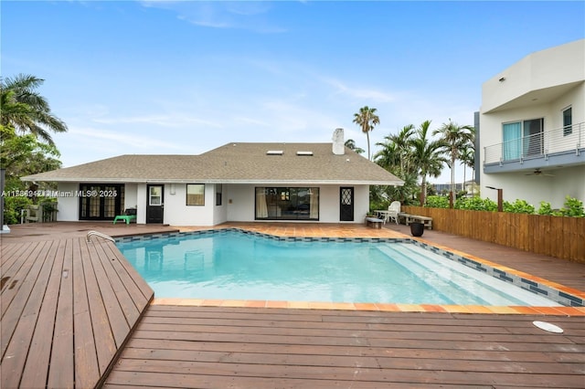 view of swimming pool featuring a deck