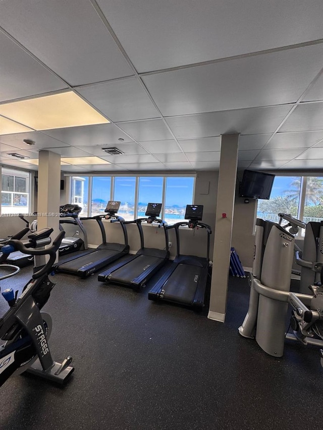 exercise room with a drop ceiling