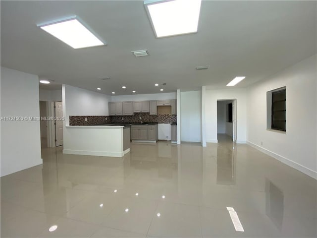 unfurnished living room featuring light tile patterned flooring