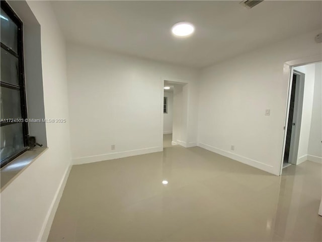 spare room with concrete flooring