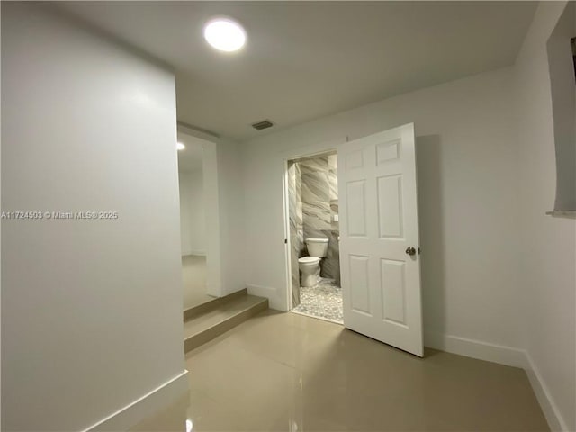 corridor featuring concrete floors