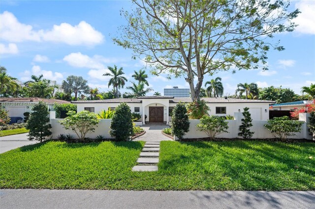 ranch-style house with a front yard