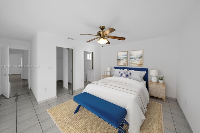 bedroom with ceiling fan and light tile patterned flooring