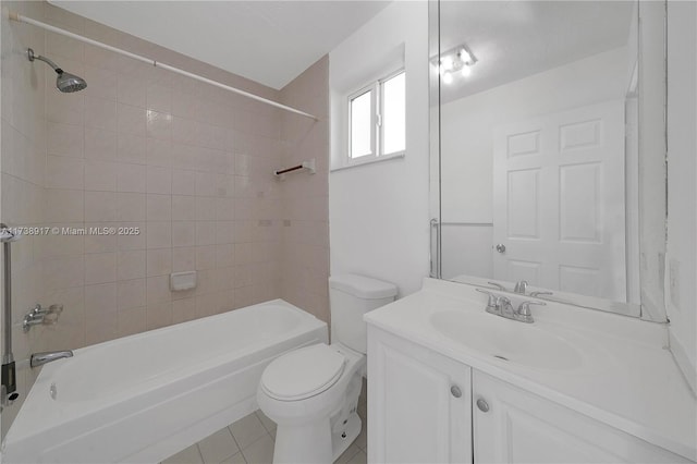 full bathroom with vanity, toilet, tiled shower / bath combo, and tile patterned flooring