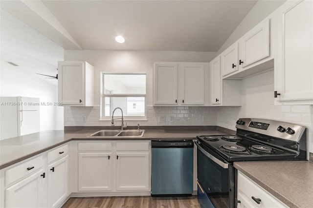 kitchen featuring white cabinets, decorative backsplash, stainless steel appliances, and a sink