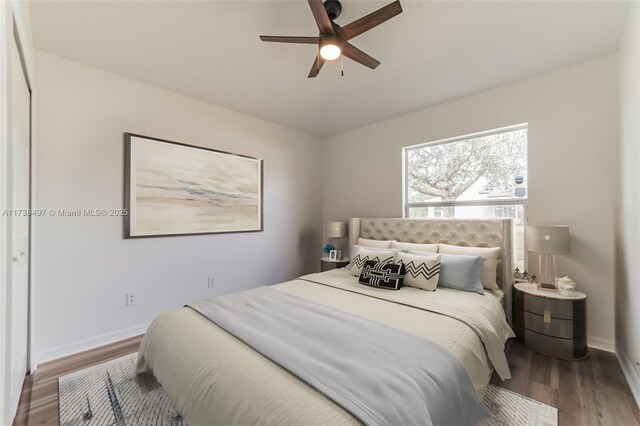 bedroom featuring hardwood / wood-style flooring and ceiling fan