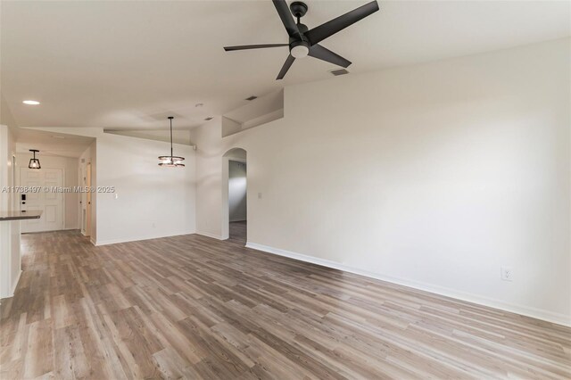 spare room with ceiling fan and light hardwood / wood-style flooring