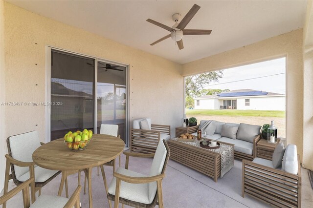 view of patio with ceiling fan and outdoor lounge area