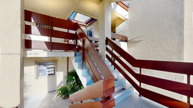 staircase with concrete floors